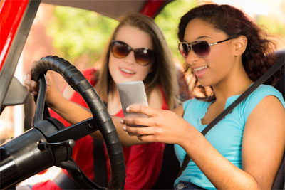 Women texting and driving